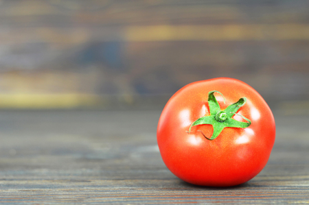 Fresh tomato on wooden backgroundの写真素材
