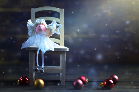 Christmas card with Christmas angel  holding Christmas starの写真素材