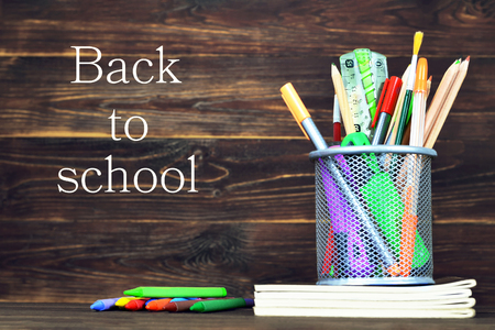 Back to school: School supplies on wooden backgroundの写真素材