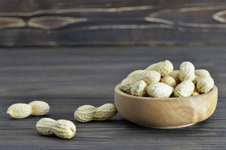 Peanuts in wooden bowlの写真素材