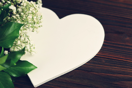 Wedding concept. White heart and white flowersの写真素材