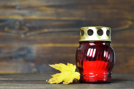 All Soul's Day. Candle and autumn leafの写真素材