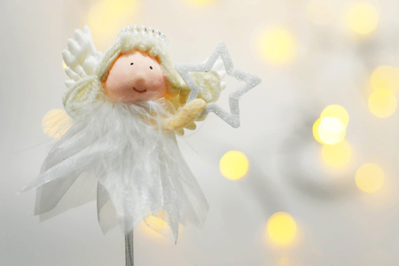 Christmas angel holding a starの写真素材