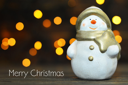Merry Christmas card. Christmas Snowman holding Christmas starの写真素材