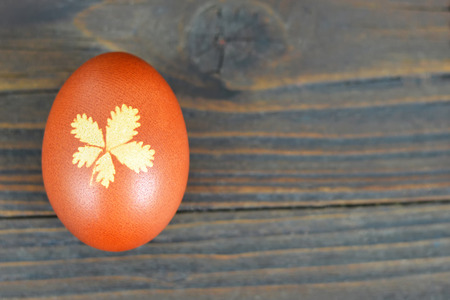 Easter egg on wooden background. Easter background with copy spaceの写真素材