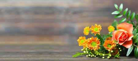 Mothers Day flowers on wooden background with copy spaceの写真素材