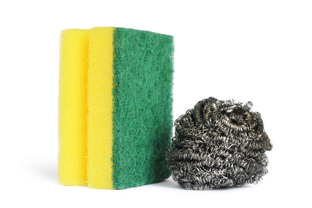 Stainless steel scrubber and kitchen sponge isolated on whiteの写真素材