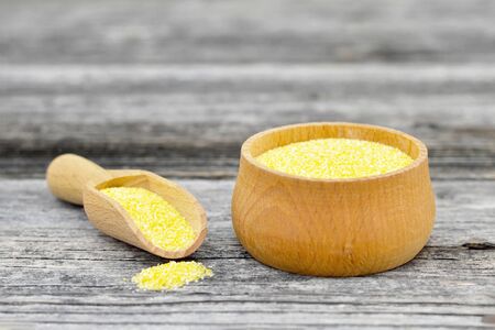 Cornmeal in wooden bowlの写真素材