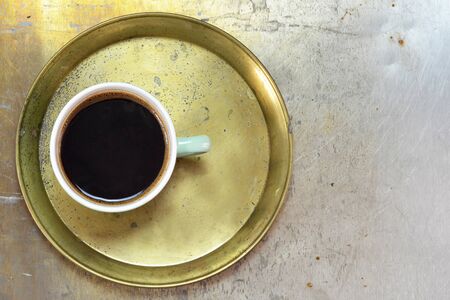 Cup of coffee on old trayの写真素材