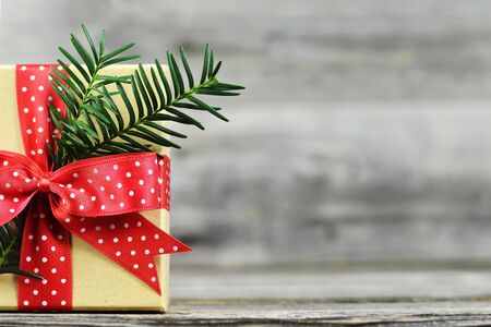 Christmas gift with red ribbon. Christmas background with copy space