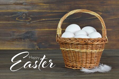 Easter card with chicken eggs in basket  の写真素材
