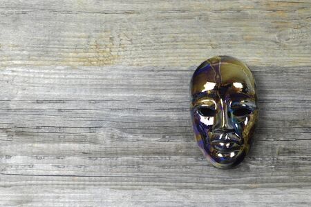 Venetian carnival masks on wooden background with copy spaceの写真素材