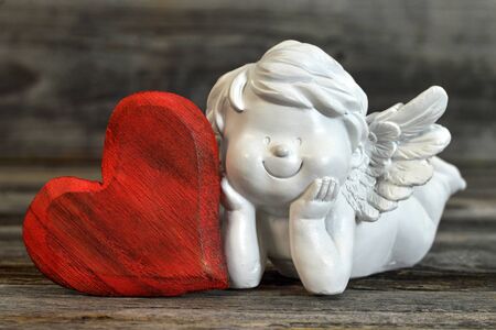 Angel and heart on wooden background. Valentines Day conceptの写真素材