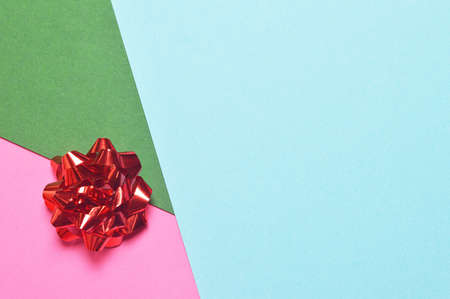 Christmas card with gift bow on paper background