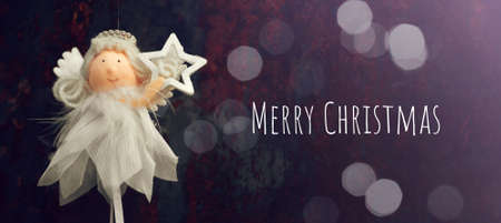 Cute Christmas angel holding Christmas star