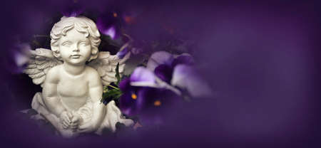 Little angel on floral background with copy spaceの写真素材