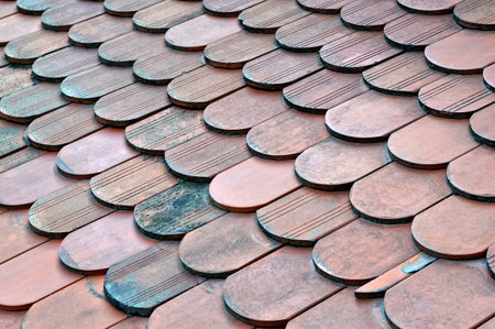 Old red clay roof tiles backgroundの写真素材