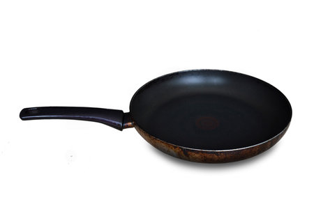 Old and dirty frying pan isolated on white backgroundの写真素材