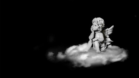 Guardian angel on the cloud isolated on black background with copy spaceの写真素材