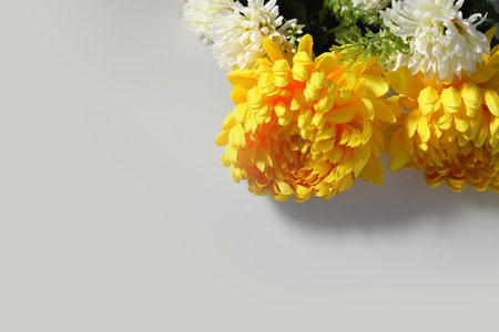 Sympathy card with chrysanthemum flowers and copy space. Condolence background concept.の写真素材