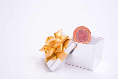 box to gift and coin on the white backgroundの写真素材
