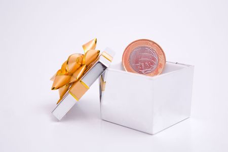 box to gift and coin on the white backgroundの写真素材