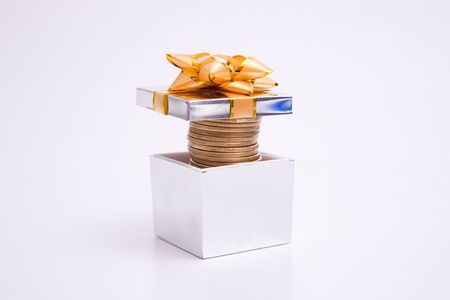 box to gift and coin on the white backgroundの写真素材
