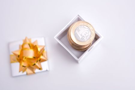 box to gift and coin on the white backgroundの写真素材