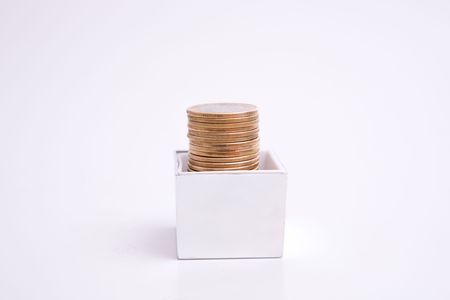 box to gift and coin on the white backgroundの写真素材
