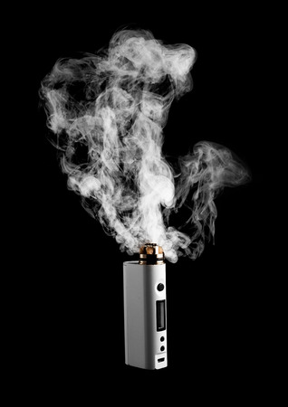 Electronic Cigarette or vaper is activating and release a cloud, black color backgroundの写真素材