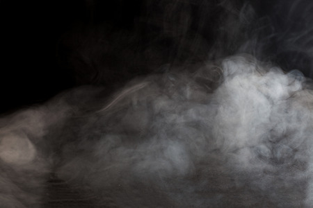 Abstract fog or smoke move on black color backgroundの写真素材