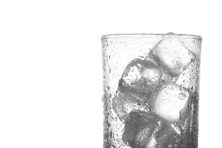 close up photo of empty glass with ice cubes isolate on white background with clipping path and copy spaceの写真素材