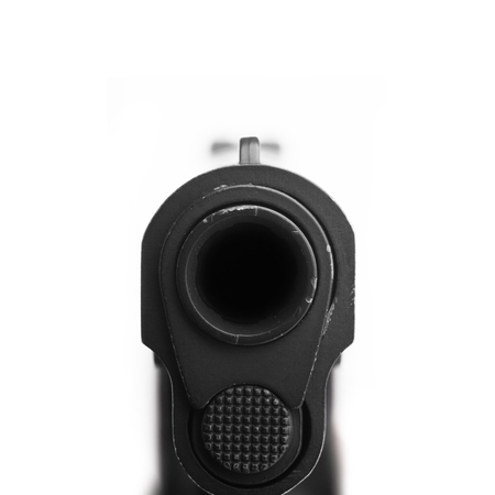 pistol pointing at a camera. Isolated on white background.の写真素材