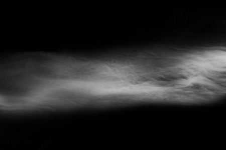 Abstract fog or smoke move on black color backgroundの写真素材