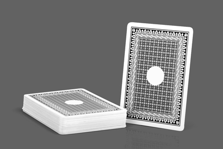 Back side of play card black color on isolated dark grey background with clipping pathの写真素材