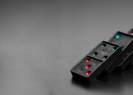 Black domino effect on dark backgroundの写真素材