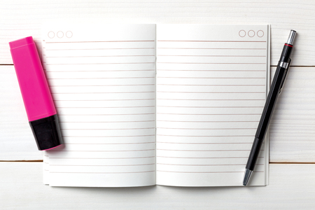 Opened personal organizer with a to do list. on white wooden backgroundの写真素材