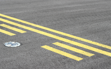 Stop line on taxiwayの写真素材