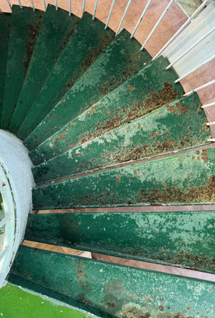 In the winter of 2025, an old spiral staircase made of steel plates at a viewing platform in a city in southern China.の写真素材