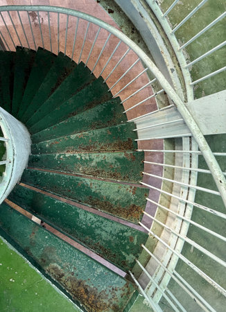 In the winter of 2025, an old spiral staircase made of steel plates at a viewing platform in a city in southern China.の写真素材