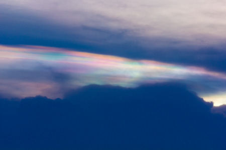 Black clouds with colorful clouds and sunlight in the evening.の写真素材
