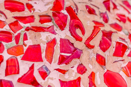 Stone and ceramic fragments on the wall sealed with cement mortar, Texture background.の写真素材