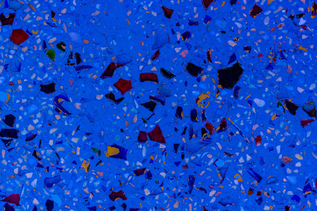 Stone and ceramic fragments on the wall sealed with cement mortar, Texture background.の写真素材