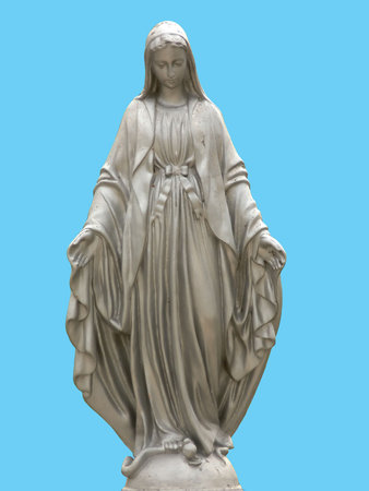 A statue of saint Mary isolated against blue backgroundの写真素材