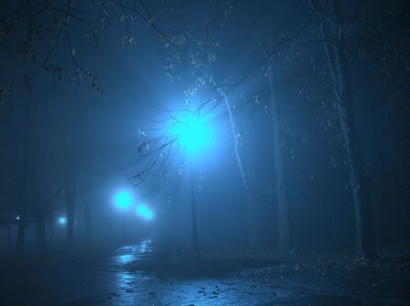 Streetlamp in the fog at nightの写真素材