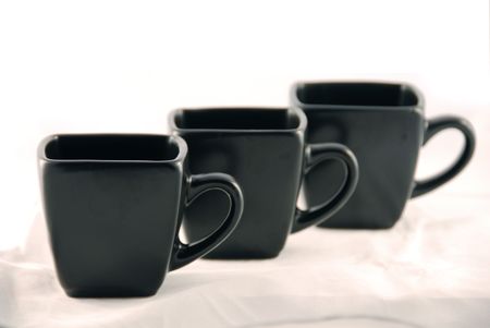 Black coffee cups isolated against white backgroundの写真素材