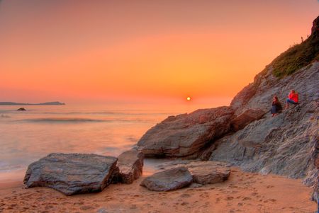 Sunset by the oceanの写真素材