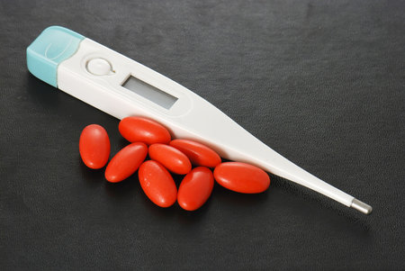 Pills and thermometer