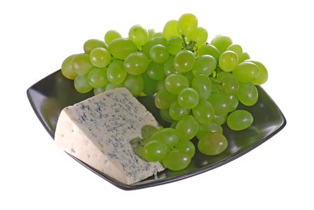 Green grapes and mold cheese isolated on white backgroundの写真素材