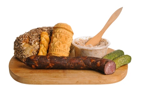 Bread, smoked cheese, sausage and other traditional food isolated on white backgroundの写真素材